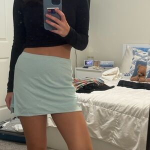 light blue high rise mini skirt with small leg slit